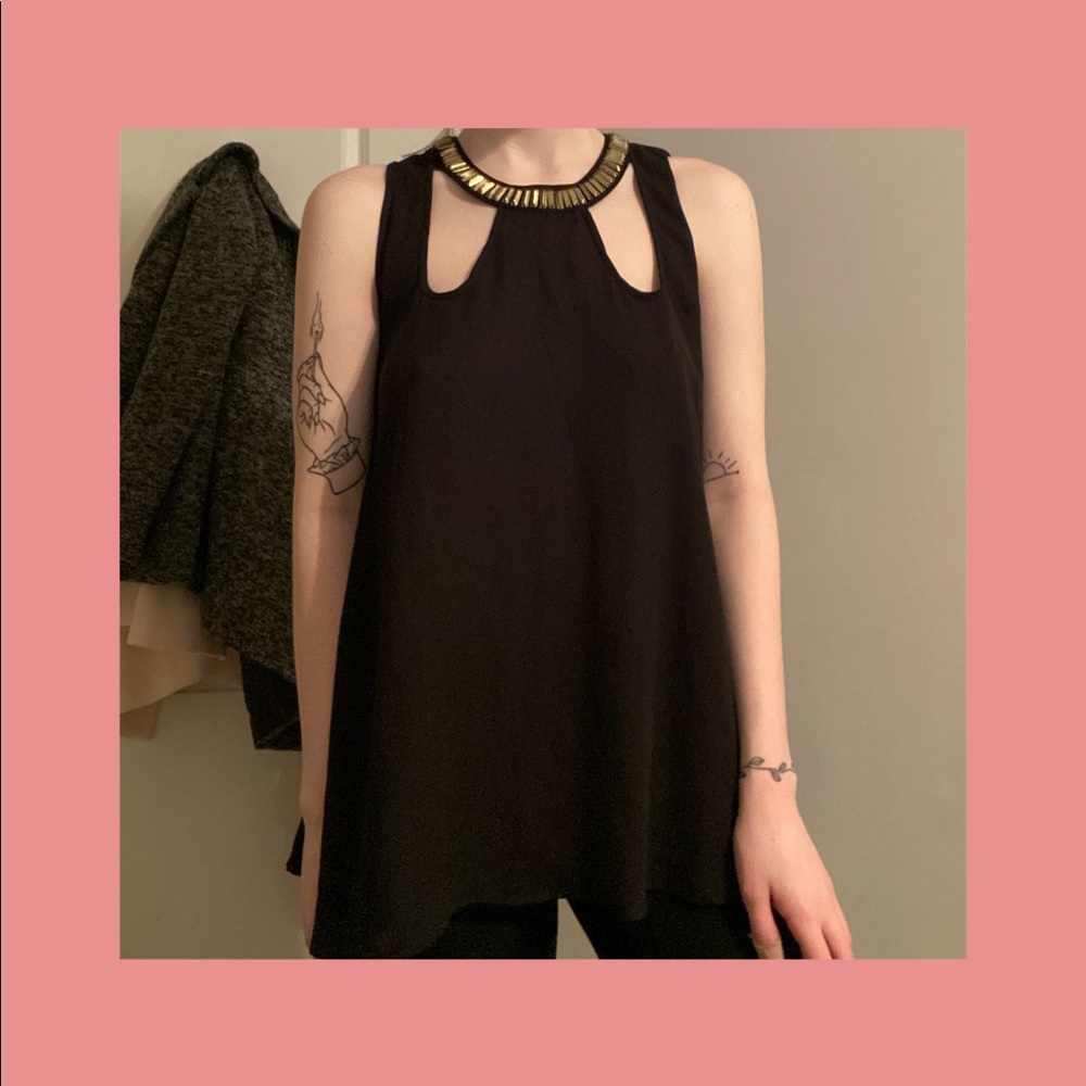 Black tank top with cut-outs and gold jewels